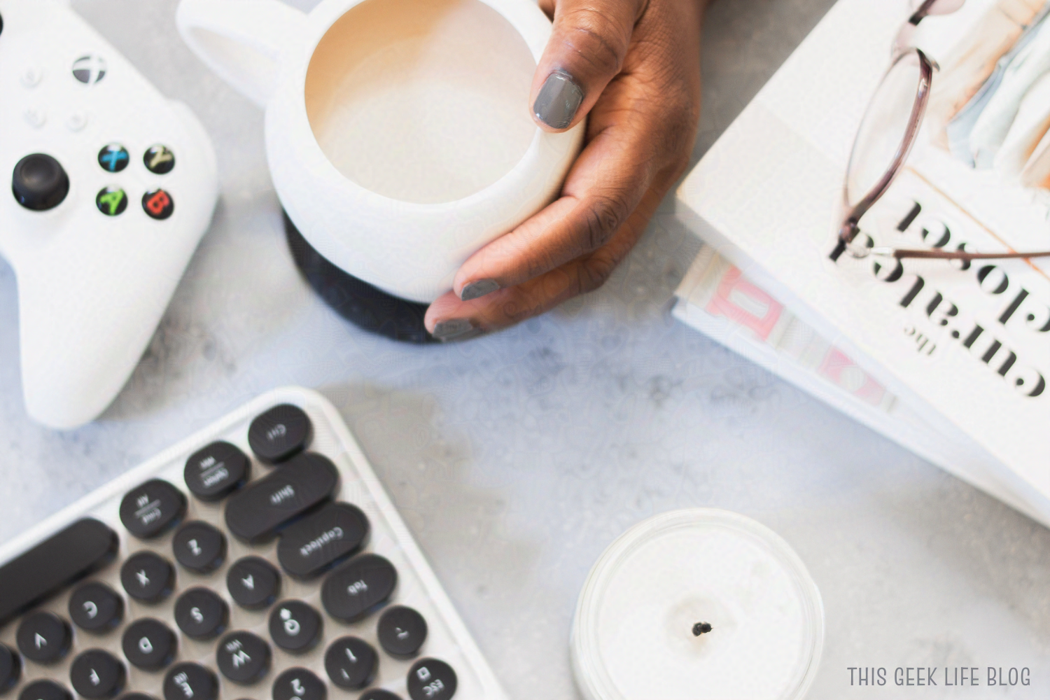 A hand holding tea, be the person you already are, This Geek Life Blog